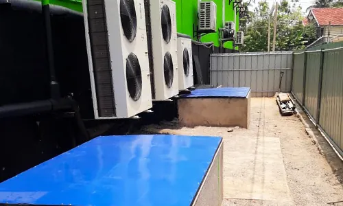 Parawewa tank covers installed beside a building in Sri Lanka
